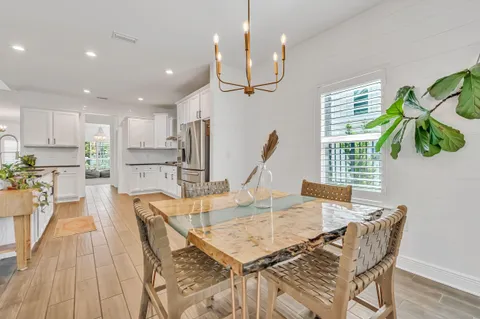 a view of a livingroom with furniture and staircase