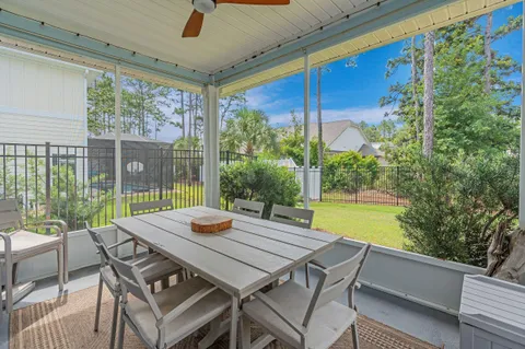 a front view of a house with swimming pool having outdoor seating
