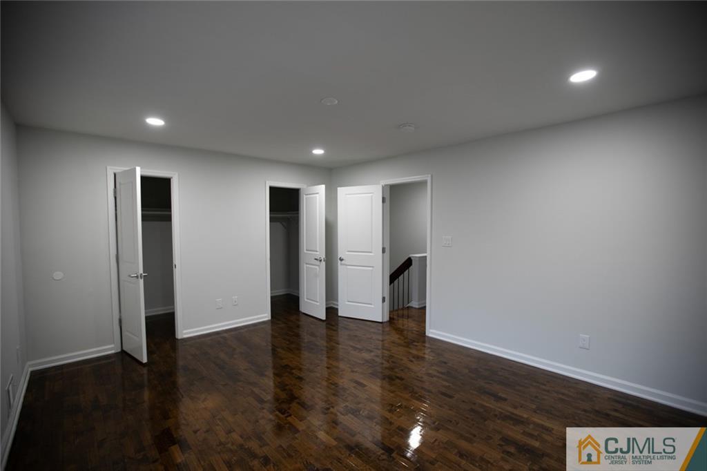 3402 Hana Road Edison, NJ 08817 - Photo 17 of 17 a view of an empty room with wooden floor