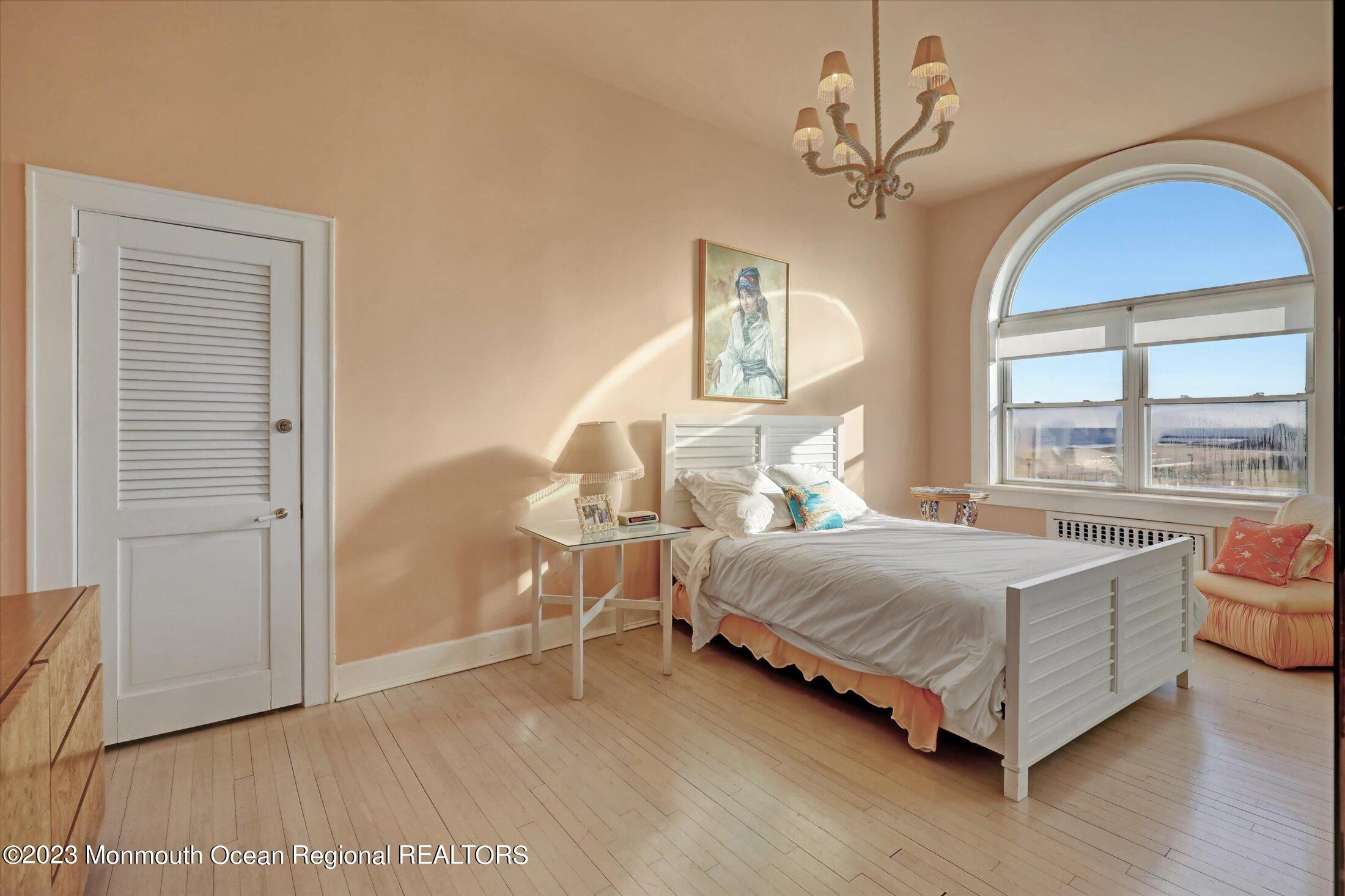 1 Roseld Avenue, Unit A3 Deal, NJ 07723 - Photo 18 of 35 a bedroom with a bed and window