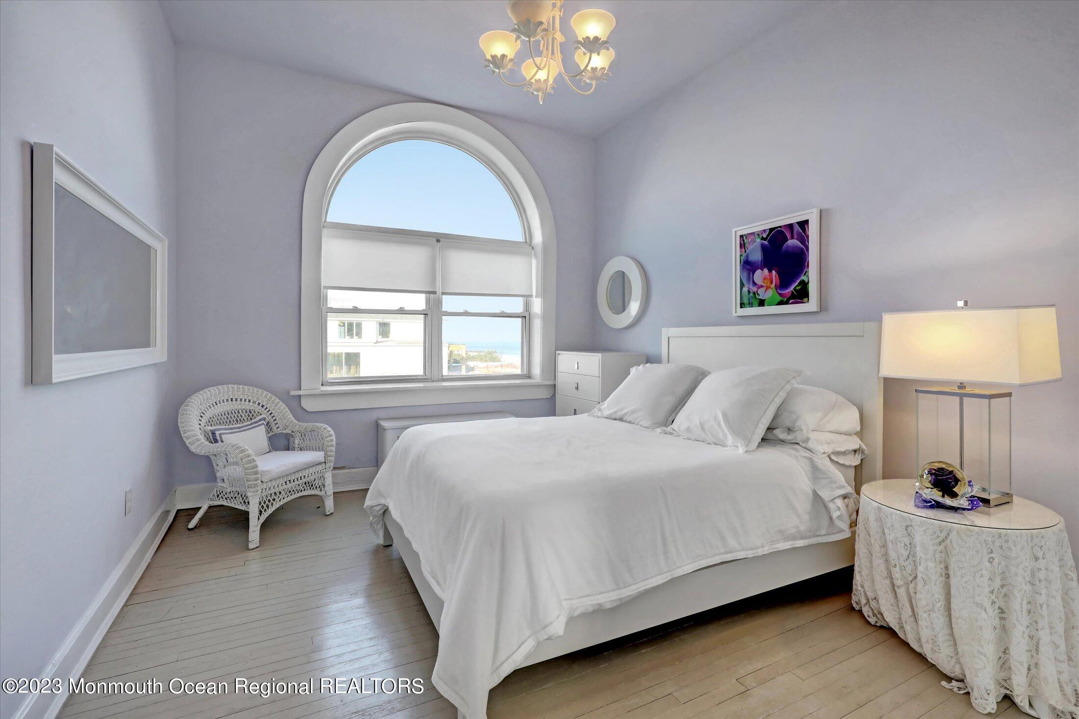1 Roseld Avenue, Unit A3 Deal, NJ 07723 - Photo 21 of 35 a bedroom with a bed and a couch