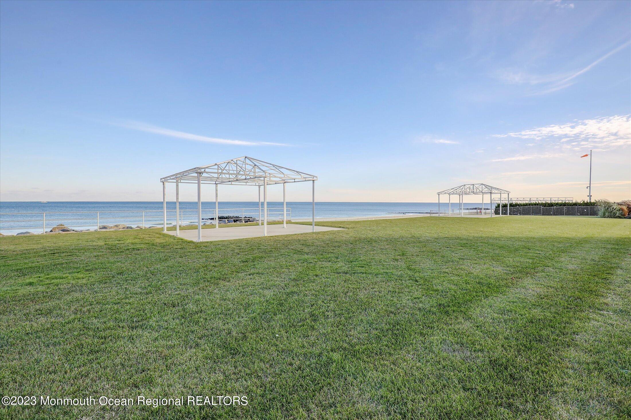 1 Roseld Avenue, Unit A3 Deal, NJ 07723 - Photo 27 of 35 a view of a big room with a big yard and large trees