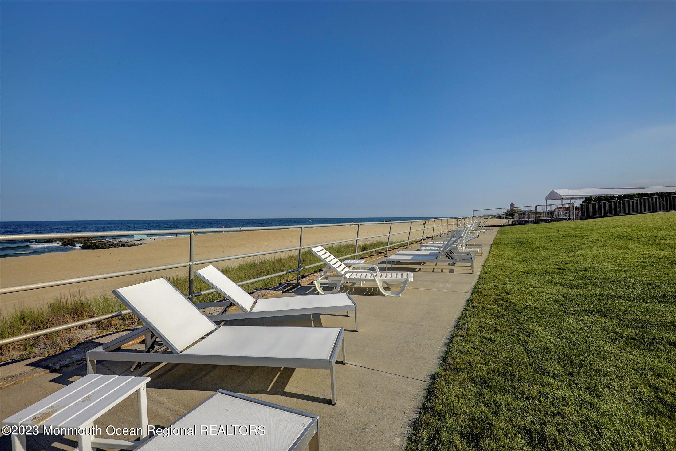 1 Roseld Avenue, Unit A3 Deal, NJ 07723 - Photo 31 of 35 a view of a swimming pool with a lounge chair