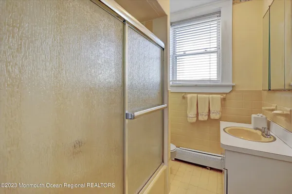 a bathroom with a sink and a shower