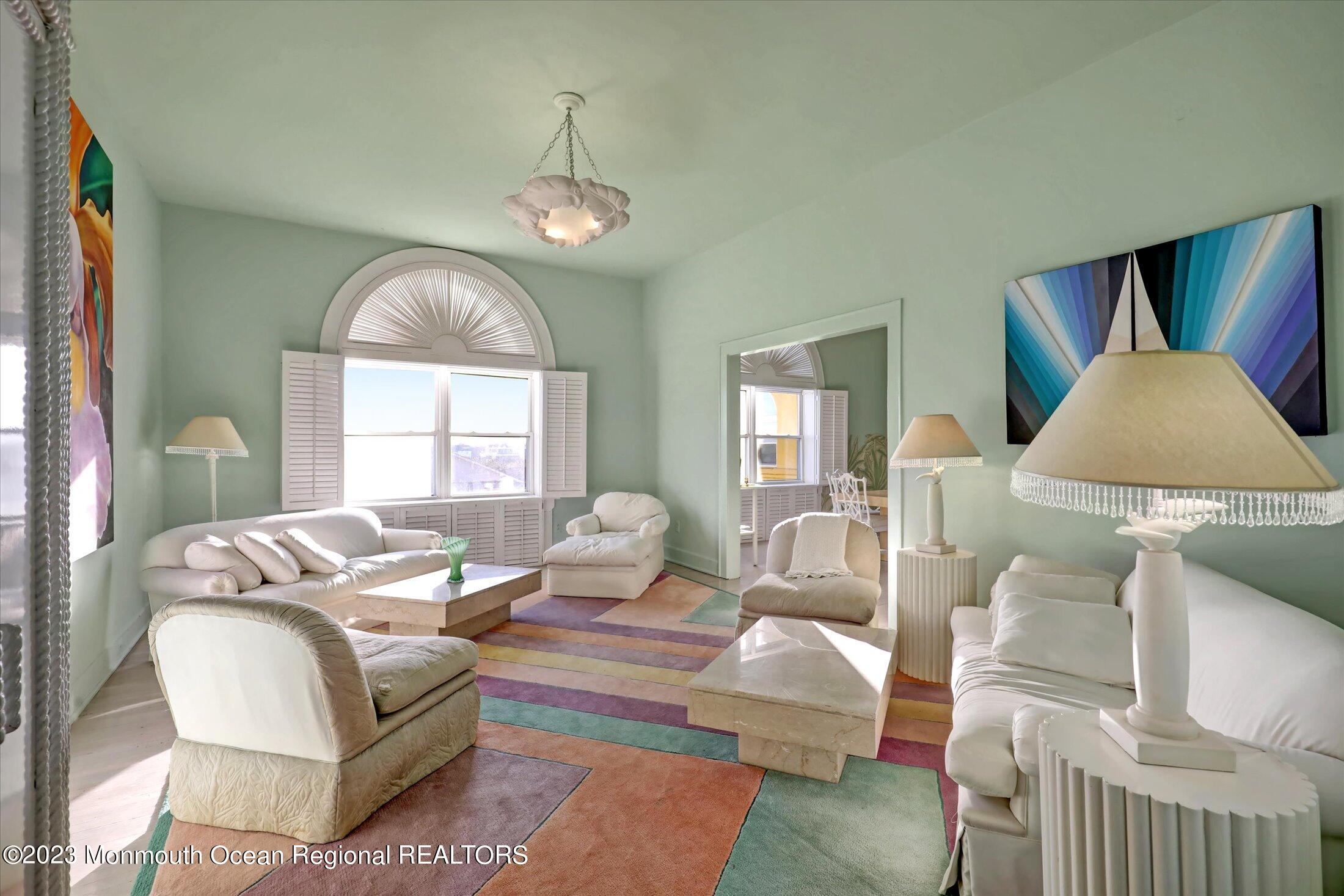 1 Roseld Avenue, Unit A3 Deal, NJ 07723 - Photo 7 of 35 a living room with furniture chandelier and a large window