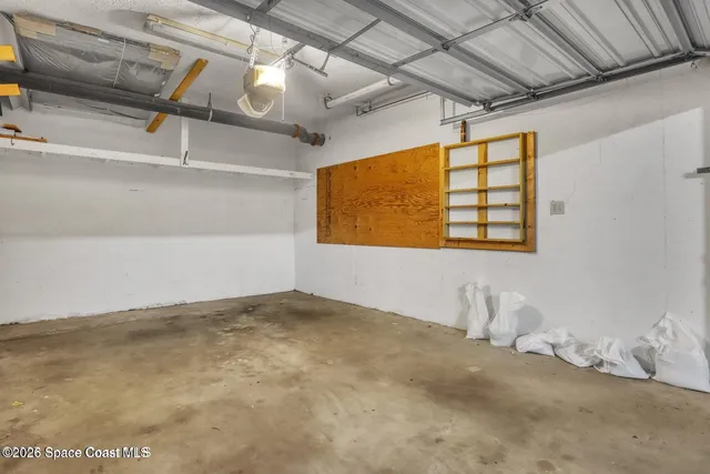 a dining room with a table chairs and a flat screen tv