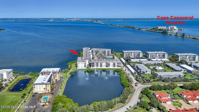 a view of a room with a table and chairs