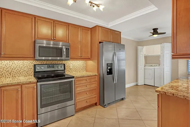 a kitchen with a stove top oven sink and cabinets