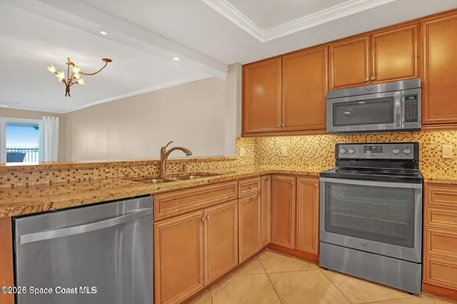 a view of a livingroom with wooden floor and staircase