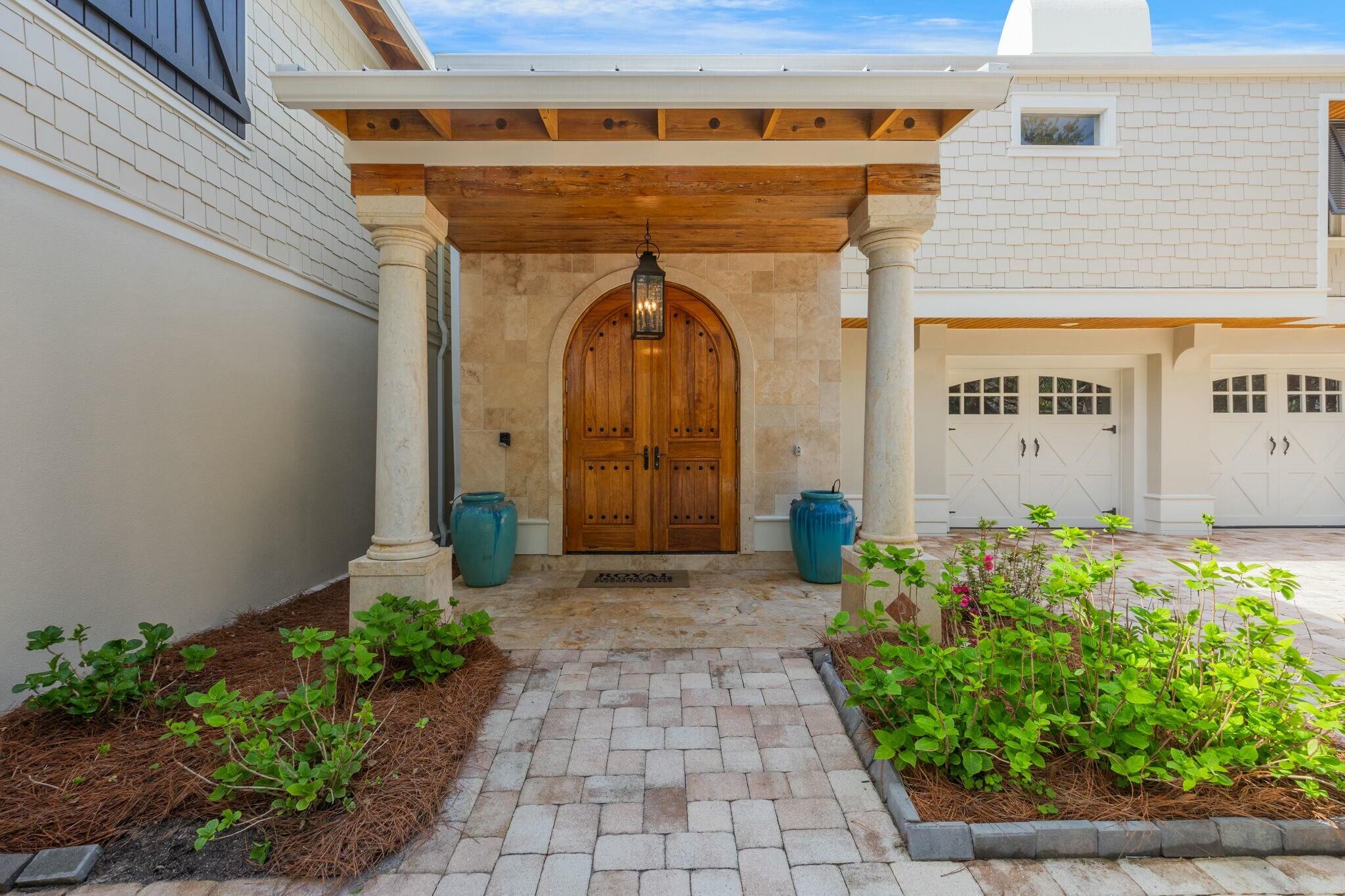 239 Pelican Circle Inlet Beach, FL 32461 - Photo 15 of 80 a front view of a building with potted plants