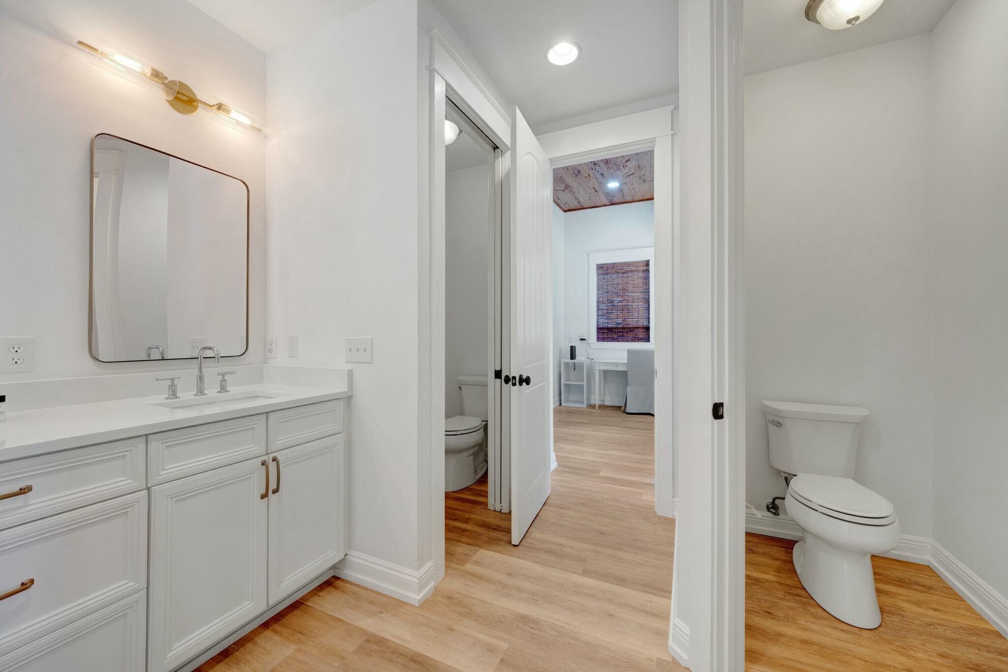 239 Pelican Circle Inlet Beach, FL 32461 - Photo 37 of 80 a bathroom with a toilet sink and mirror