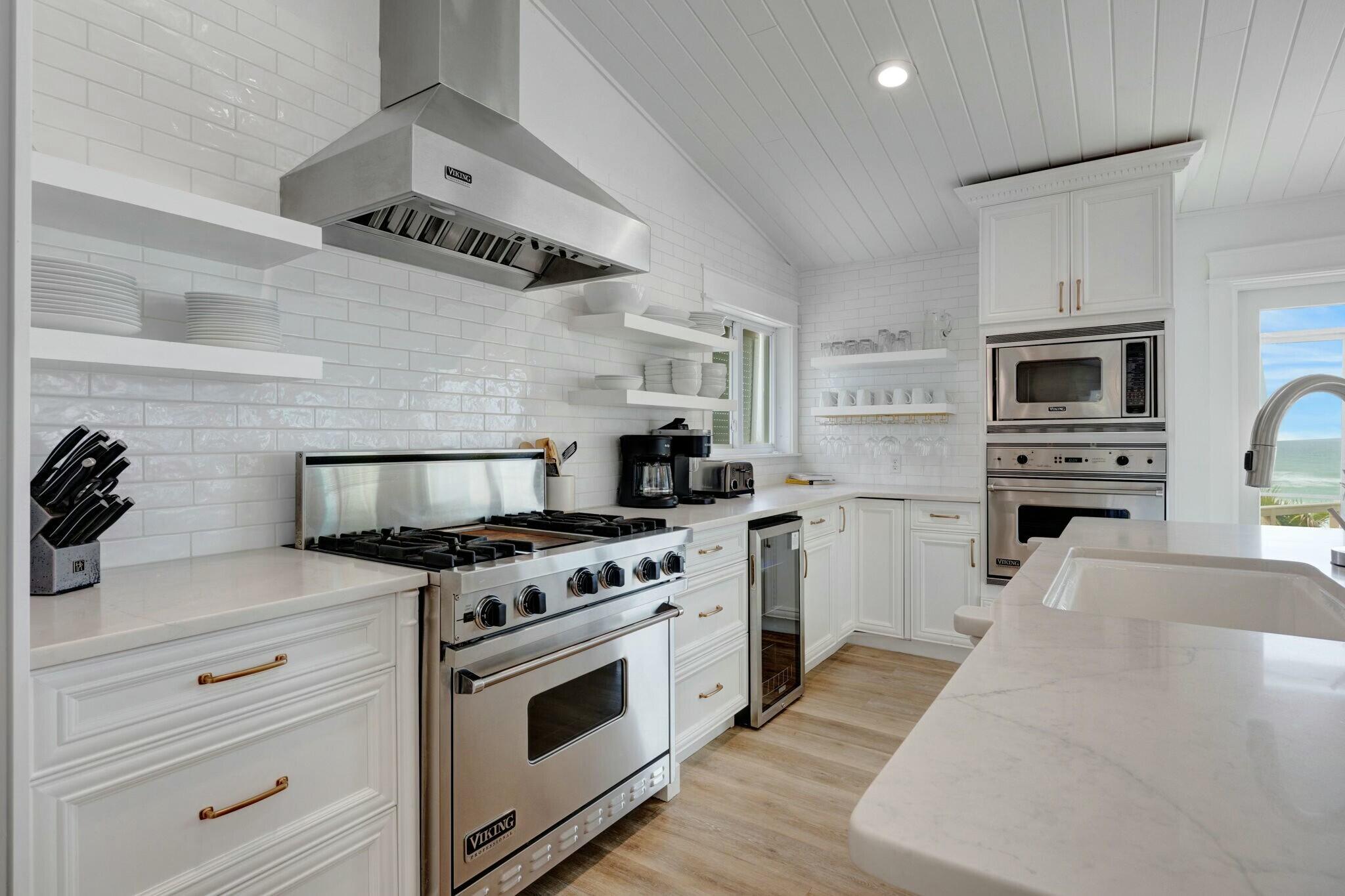 239 Pelican Circle Inlet Beach, FL 32461 - Photo 50 of 80 a kitchen with granite countertop a stove and a sink