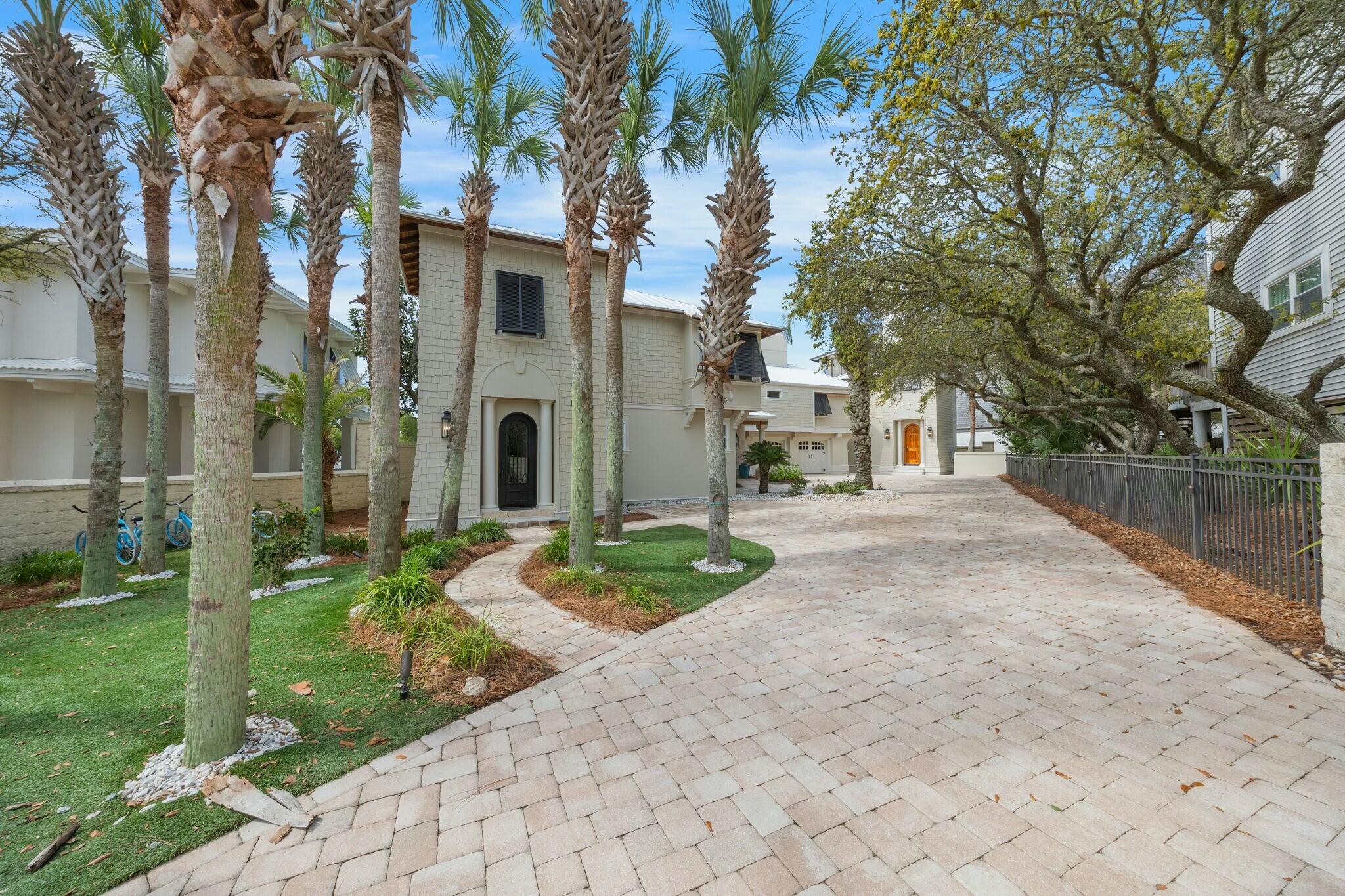 239 Pelican Circle Inlet Beach, FL 32461 - Photo 5 of 80 a front view of a house with garden