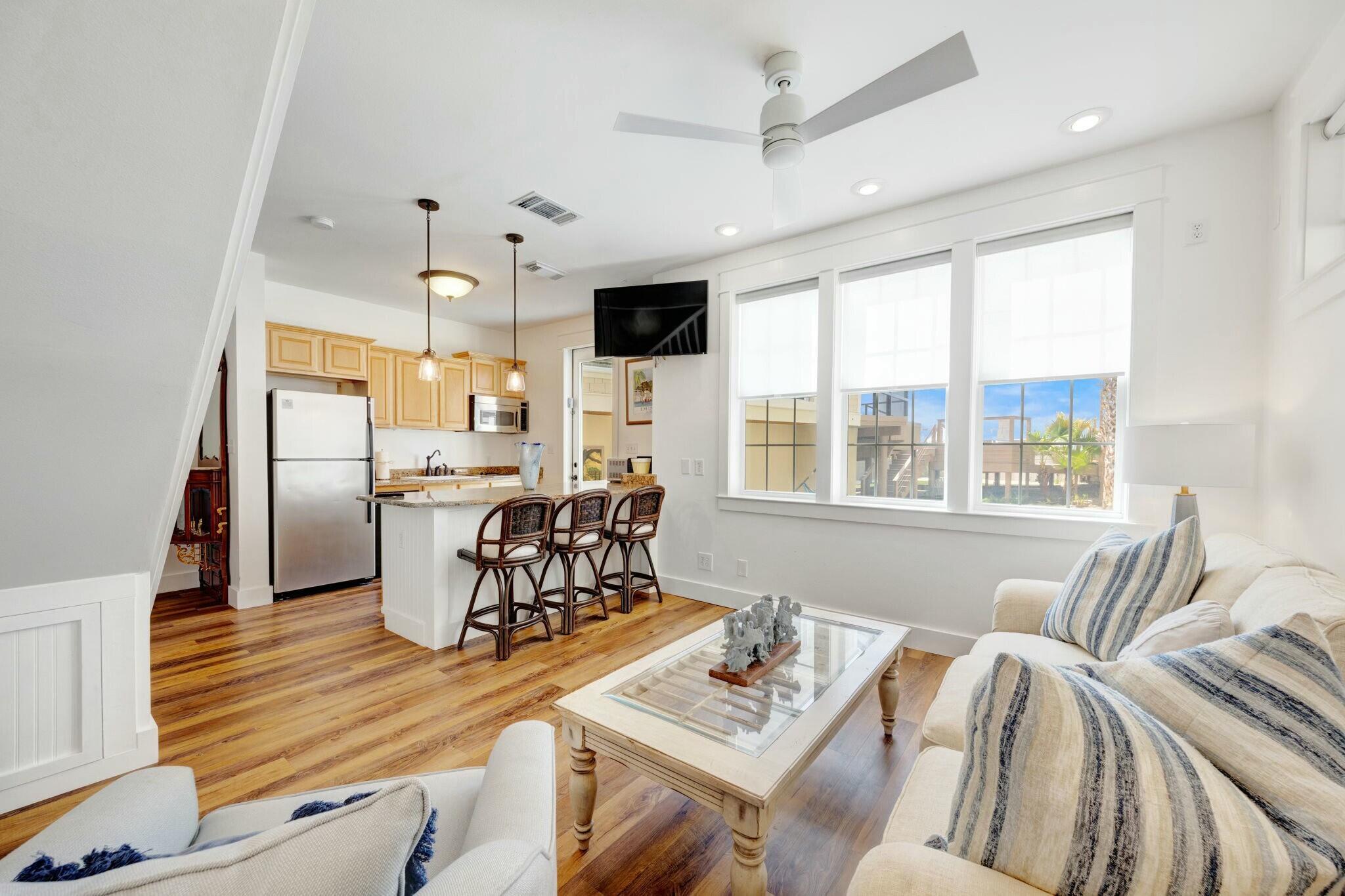 239 Pelican Circle Inlet Beach, FL 32461 - Photo 69 of 80 a living room with furniture a bed and a dining table with wooden floor