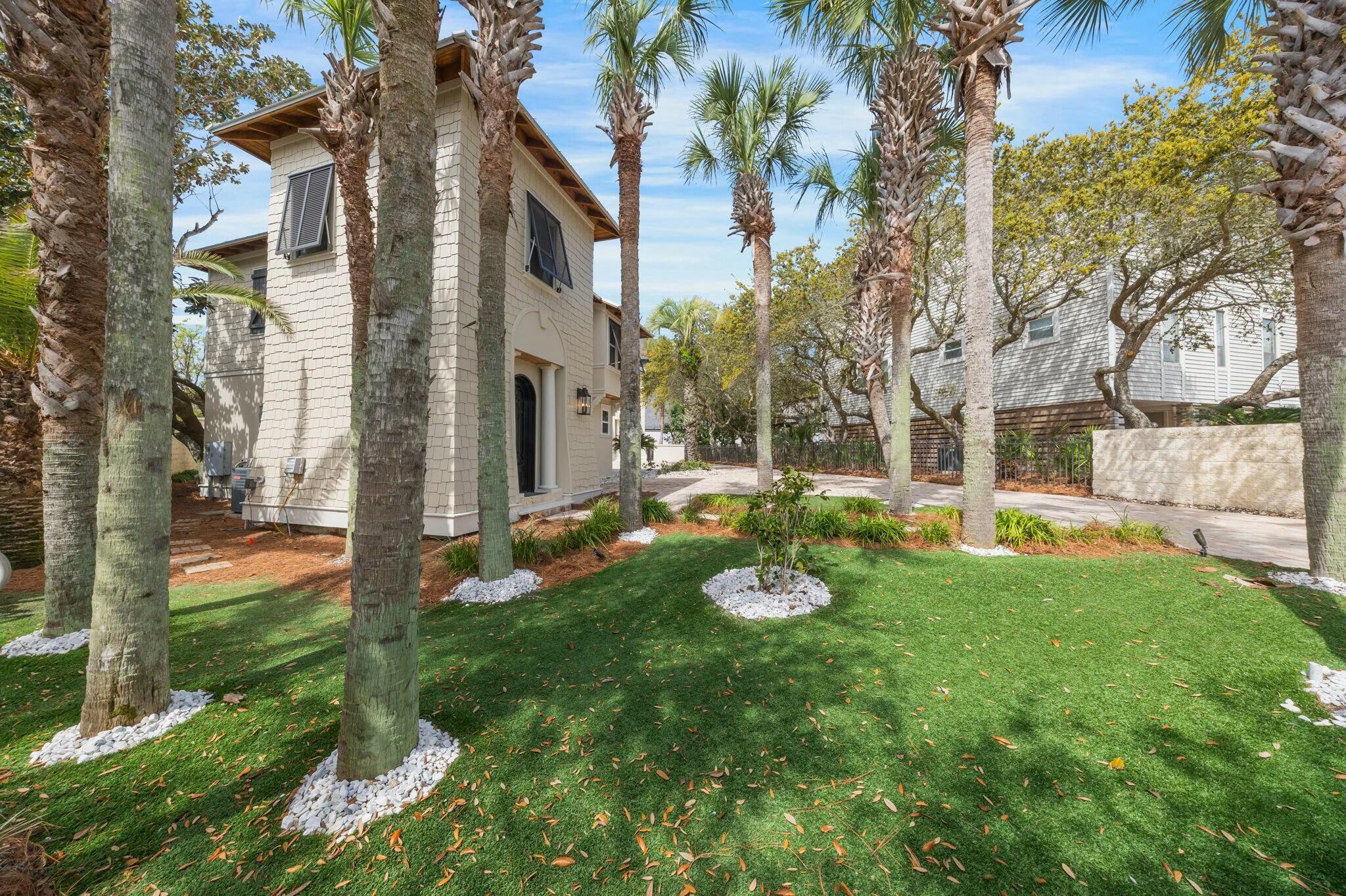 239 Pelican Circle Inlet Beach, FL 32461 - Photo 75 of 80 a view of a house with backyard and sitting area