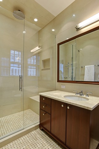 6 East Scott Street, Unit 6 Chicago, IL 60610 - Photo 12 of 25 a bathroom with a sink a vanity and a mirror