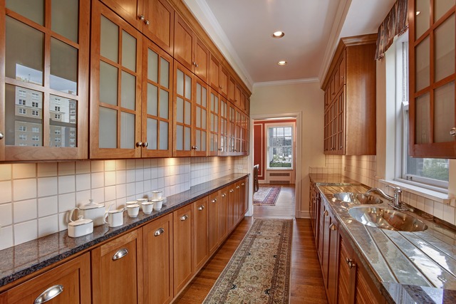 6 East Scott Street, Unit 6 Chicago, IL 60610 - Photo 7 of 25 a kitchen with stainless steel appliances granite countertop a sink stove and cabinets