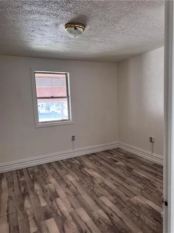 a view of small space with wooden floor