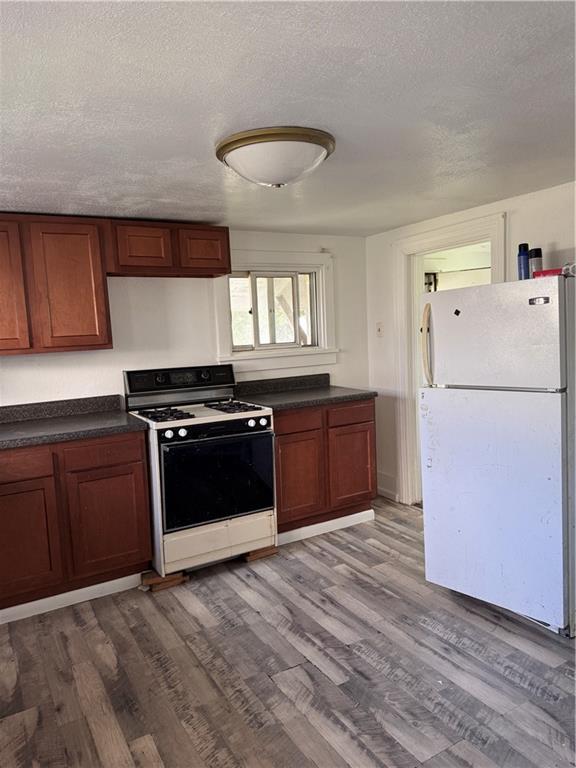 137 Sherman Avenue Vandergrift, PA 15690 - Photo 7 of 31 a kitchen with a refrigerator and a stove