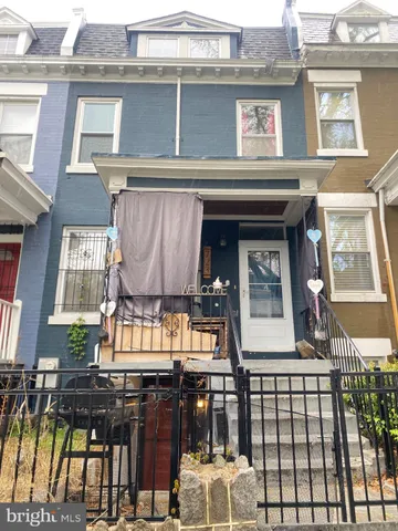 a view of a brick building with large windows