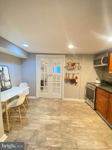 a view of a livingroom with furniture and workspace