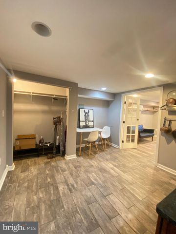 a view of a livingroom with furniture and a window