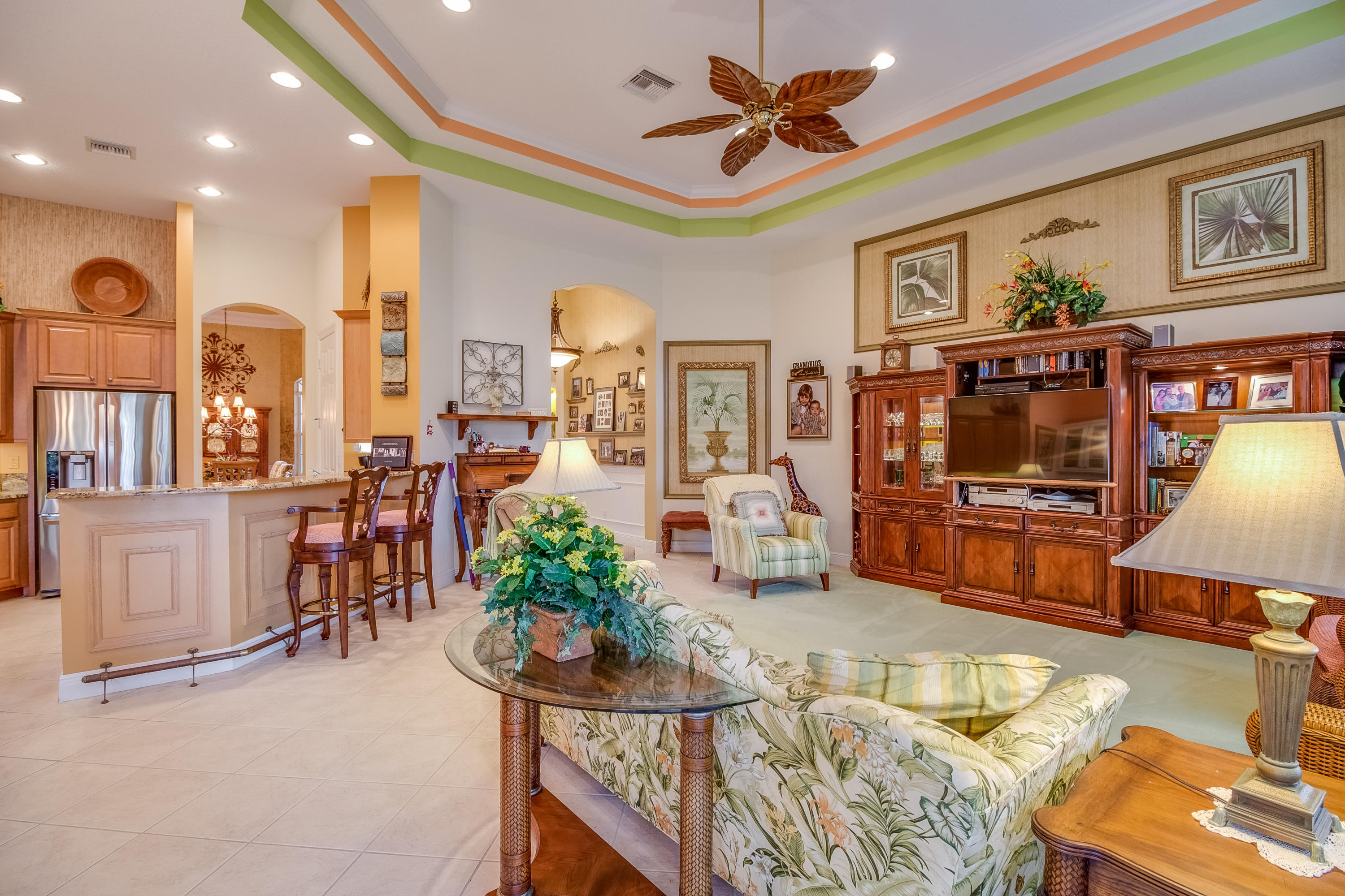 8617 Tompson Point Road Port St. Lucie, FL 34986 - Photo 15 of 38 a living room with furniture and a flat screen tv