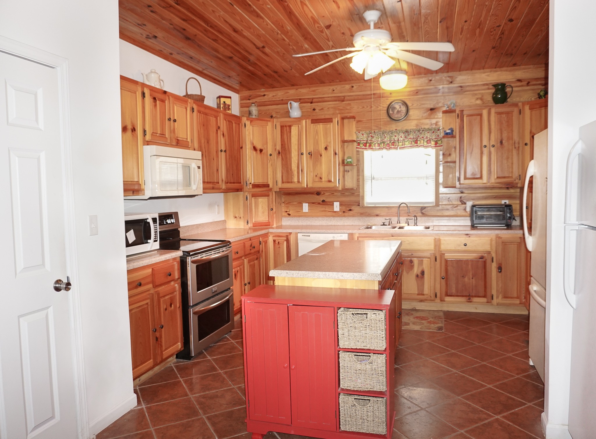 488 Meyers Road Altamont, TN 37301 - Photo 9 of 32 a kitchen with stainless steel appliances granite countertop a sink stove and refrigerator