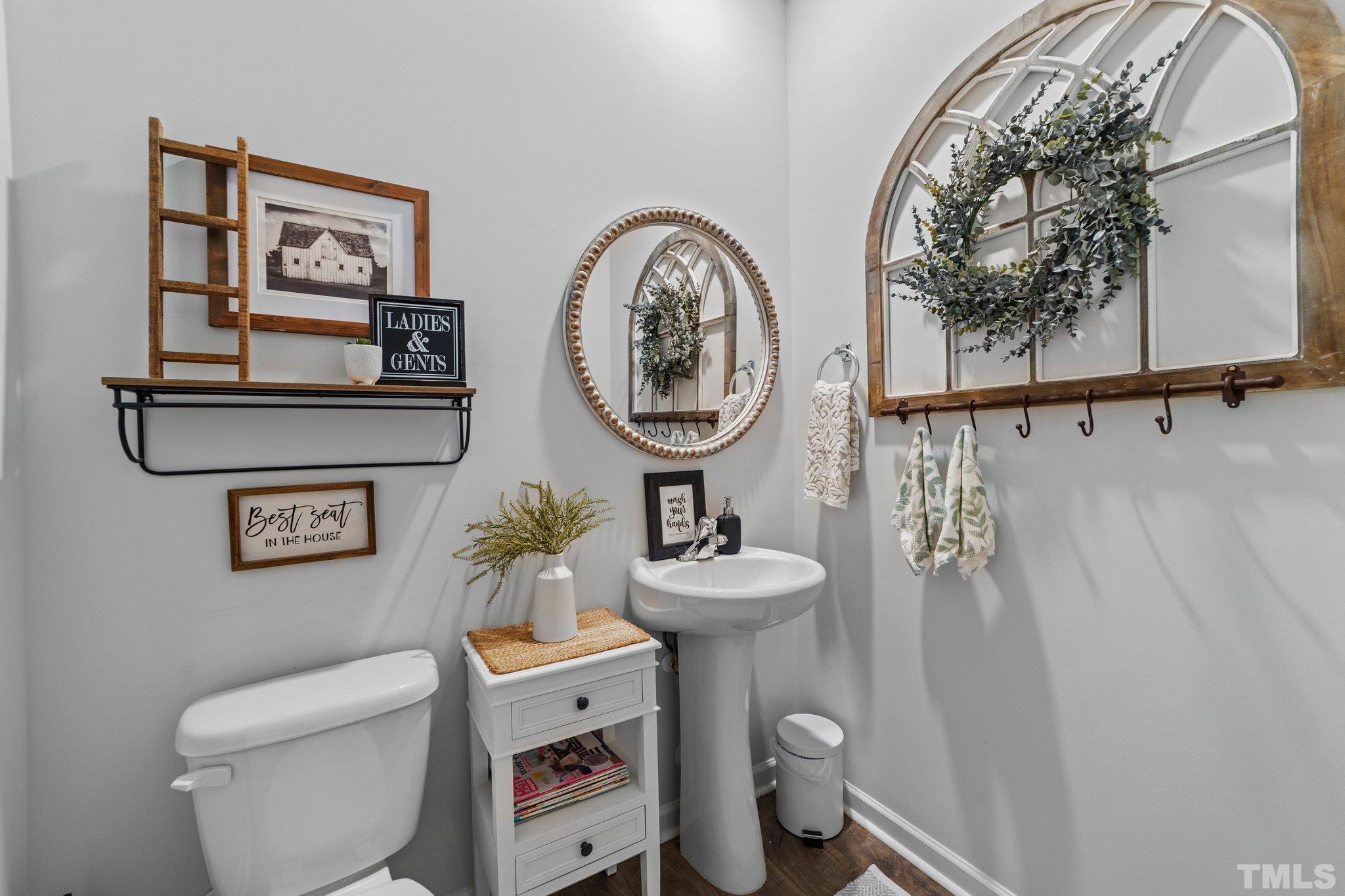 3116 Longpine Road Burlington, NC 27215 - Photo 15 of 29 a bathroom with a toilet a sink and a mirror