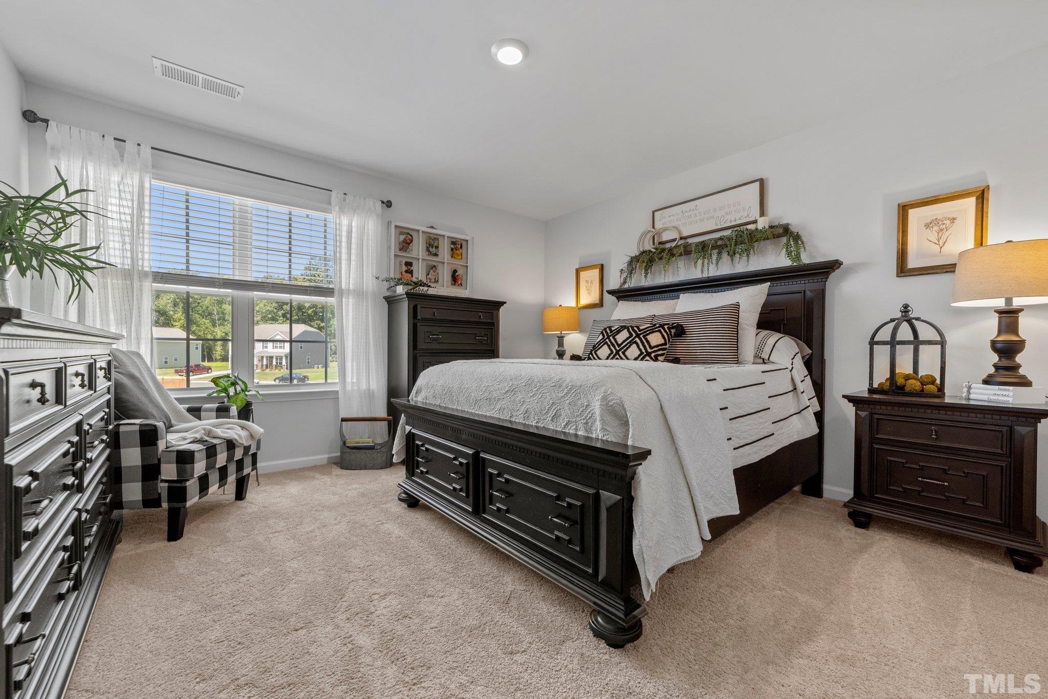 3116 Longpine Road Burlington, NC 27215 - Photo 21 of 29 a bed room with a bed and a chair