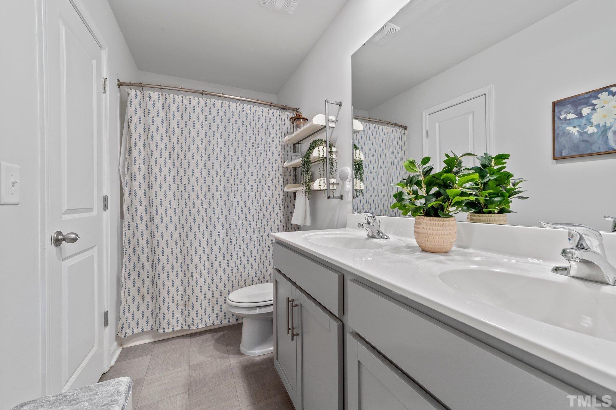 3116 Longpine Road Burlington, NC 27215 - Photo 24 of 29 a bathroom with a sink and a toilet