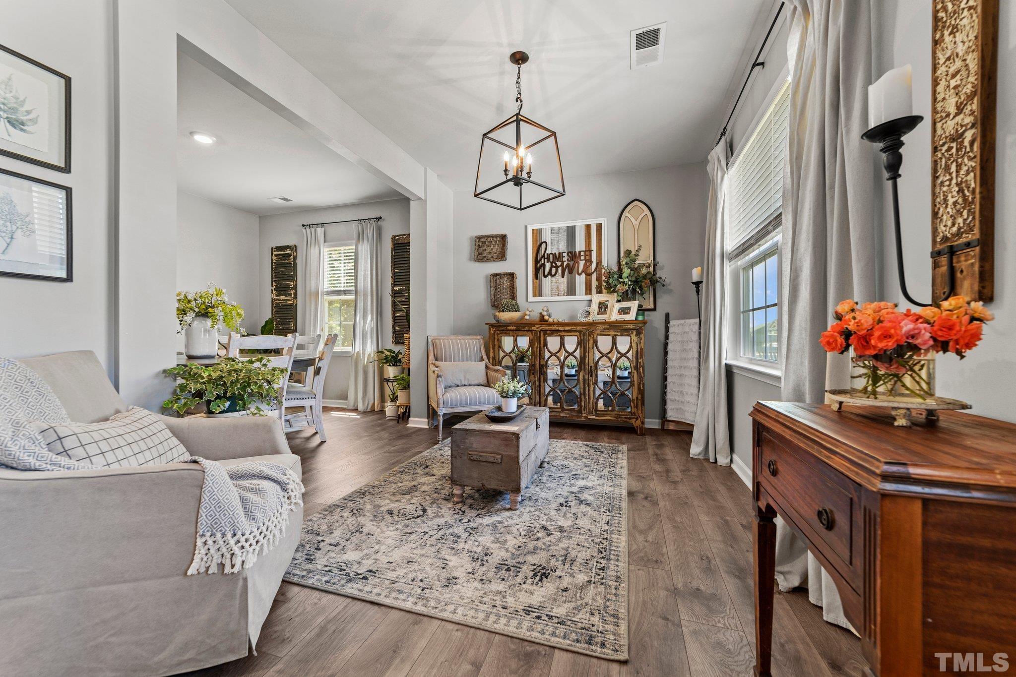 3116 Longpine Road Burlington, NC 27215 - Photo 6 of 29 a living room with furniture flowerpot and wooden floor