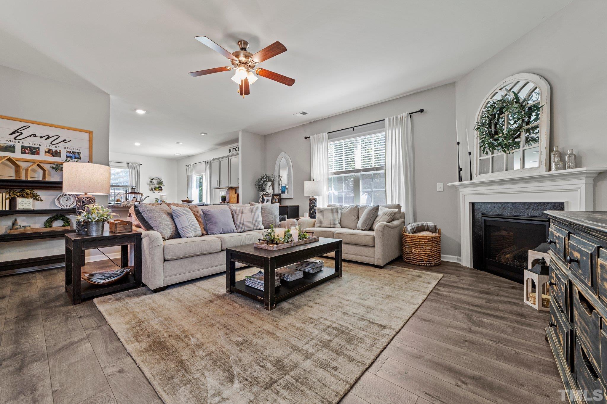 3116 Longpine Road Burlington, NC 27215 - Photo 8 of 29 a living room with furniture and a fireplace