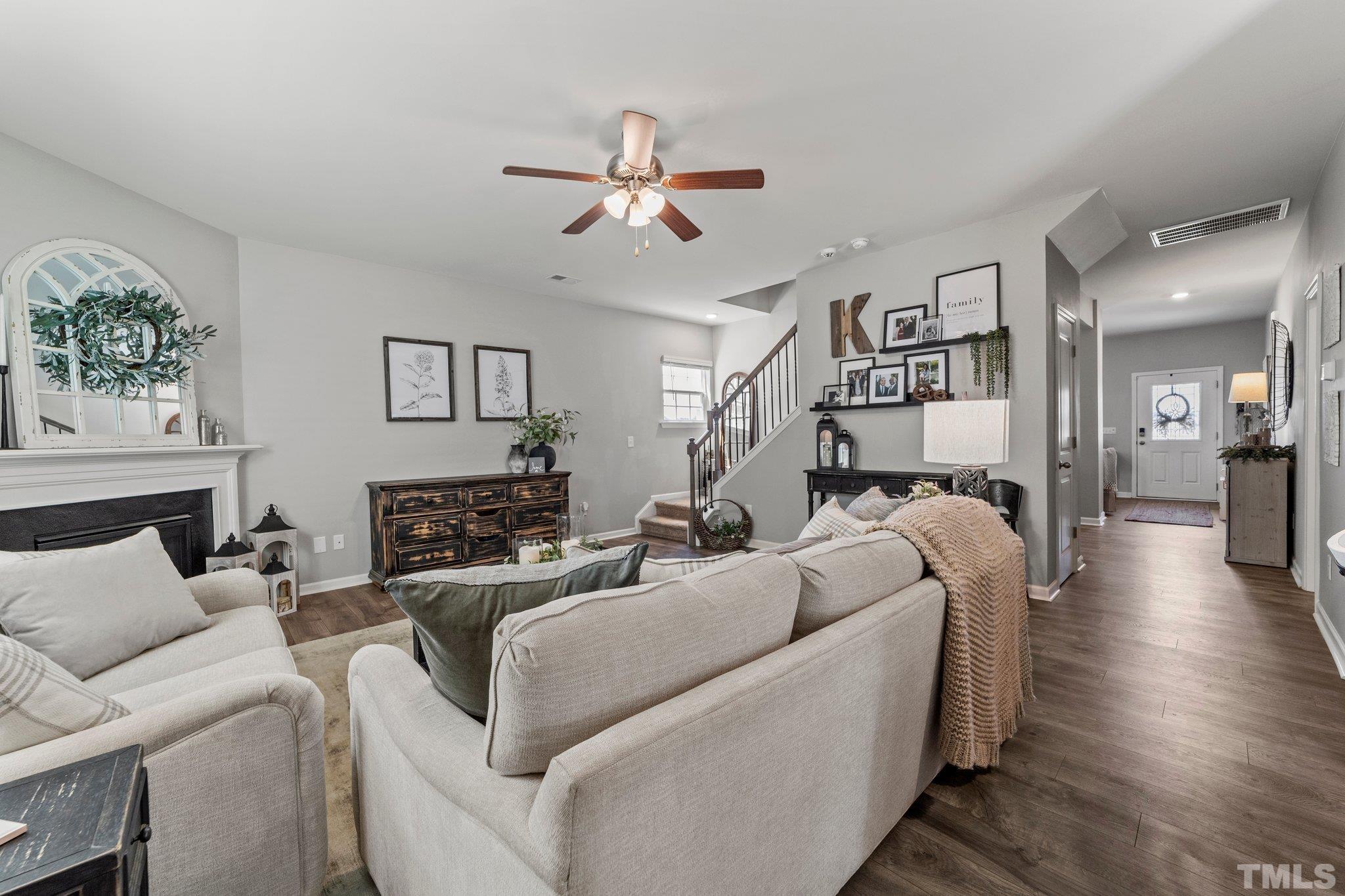 3116 Longpine Road Burlington, NC 27215 - Photo 9 of 29 a living room with furniture and a chandelier