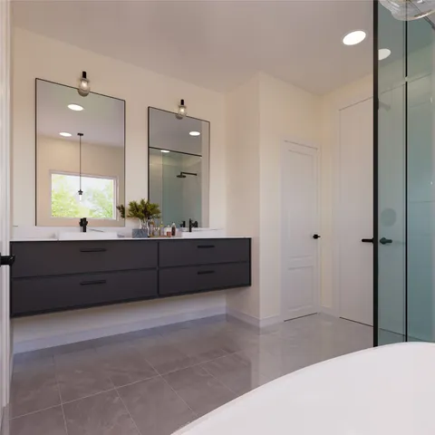a bathroom with a tub a double vanity sink and mirror