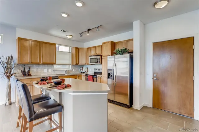 a bedroom with a bed and a lamp