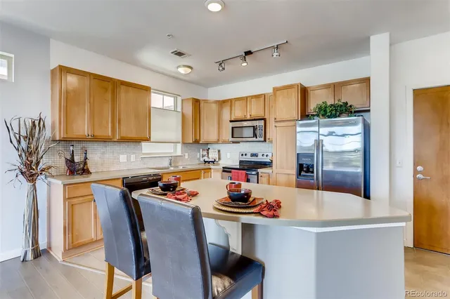 a living room with hard wood flooring
