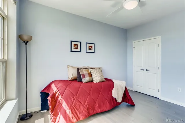 a view of a hallway with stainless steel appliances kitchen area