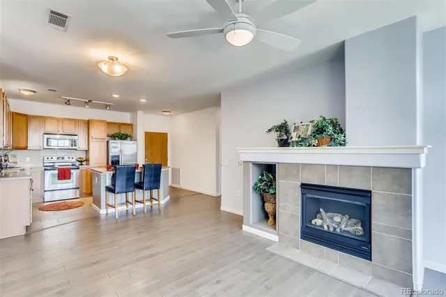 a view of a kitchen counter space a stove and wooden floor