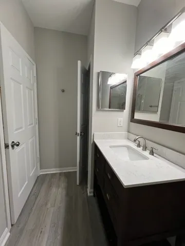 a bathroom with a sink and a mirror