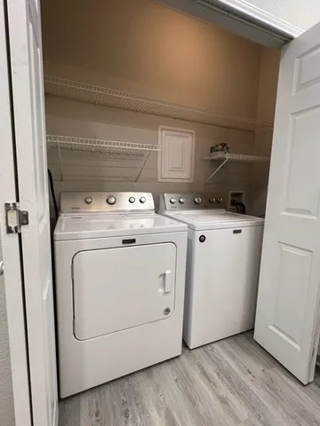 a utility room with dryer and washer
