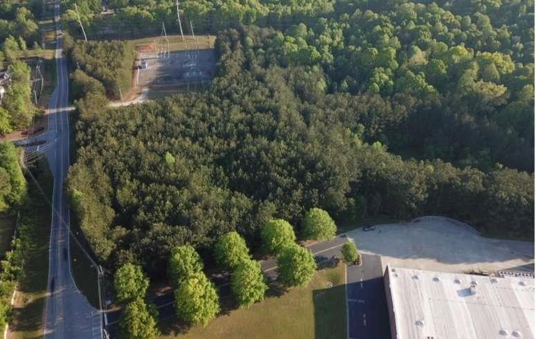 a aerial view of a house with a yard