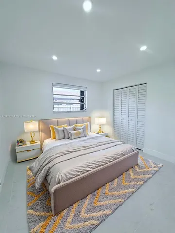 a utility room with cabinets washer and dryer