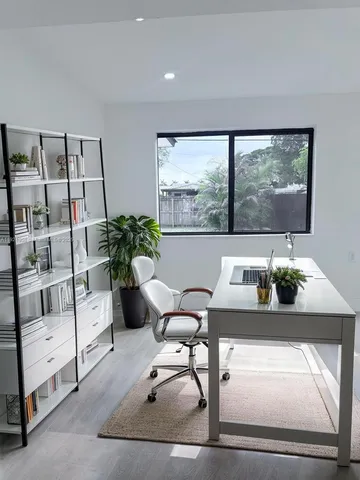 a bedroom with bed and window