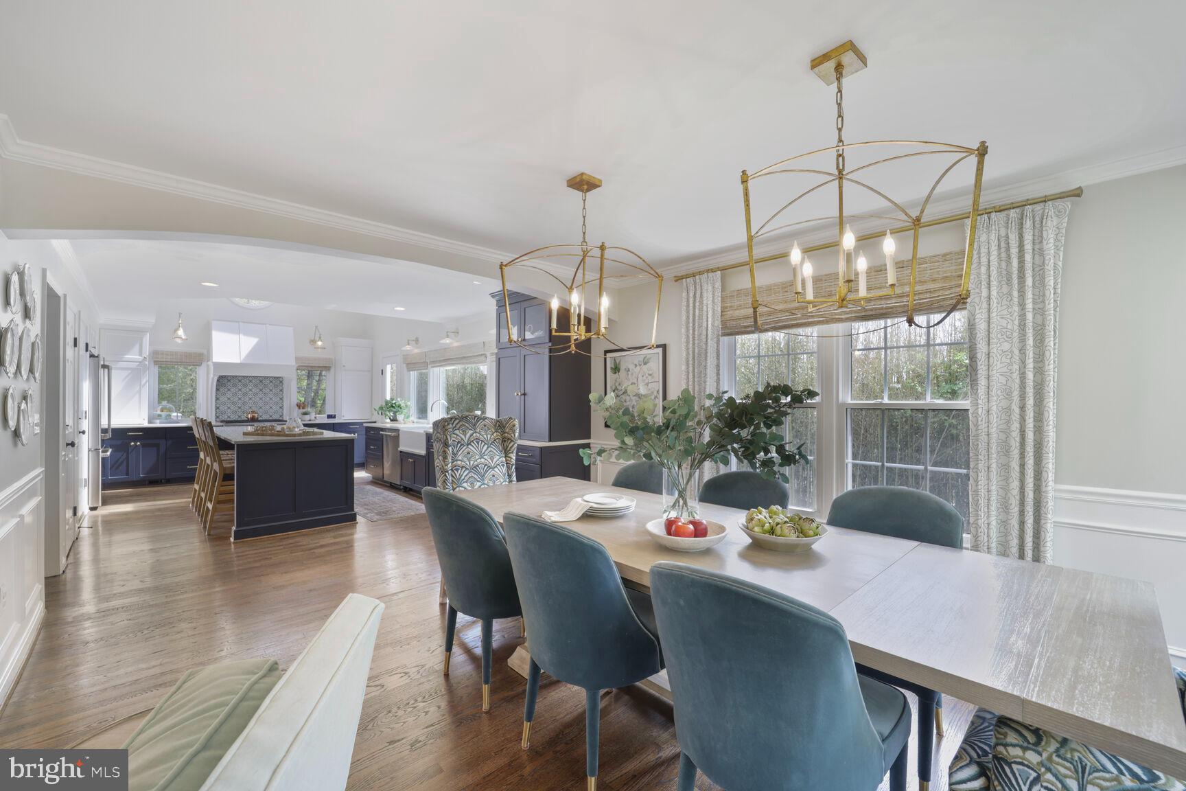 3012 Marlow Road Silver Spring, MD 20904 - Photo 8 of 49 a dining room with furniture a chandelier and wooden floor