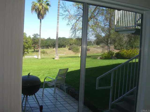 a view of a lake from a porch