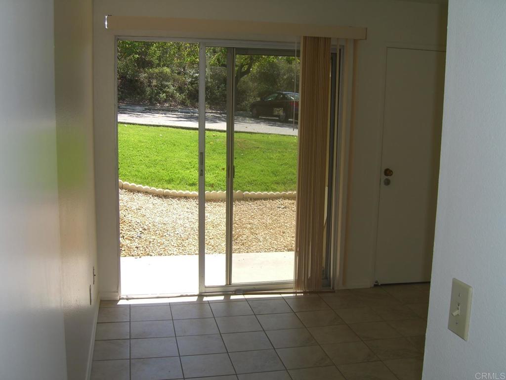 27715 Mountain Meadow Road, Unit 39 Escondido, CA 92026 - Photo 3 of 4 a view of an empty room and window