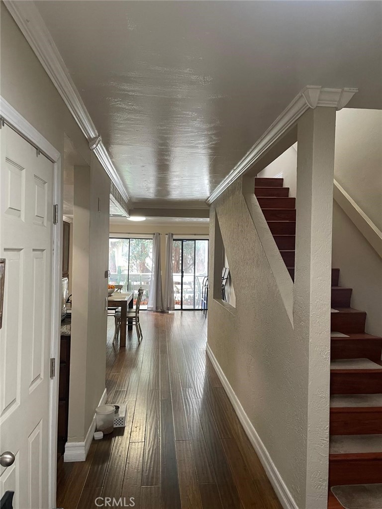404 Brighton Springs Costa Mesa, CA 92627 - Photo 9 of 22 a view of dining room with wooden floor and stairs