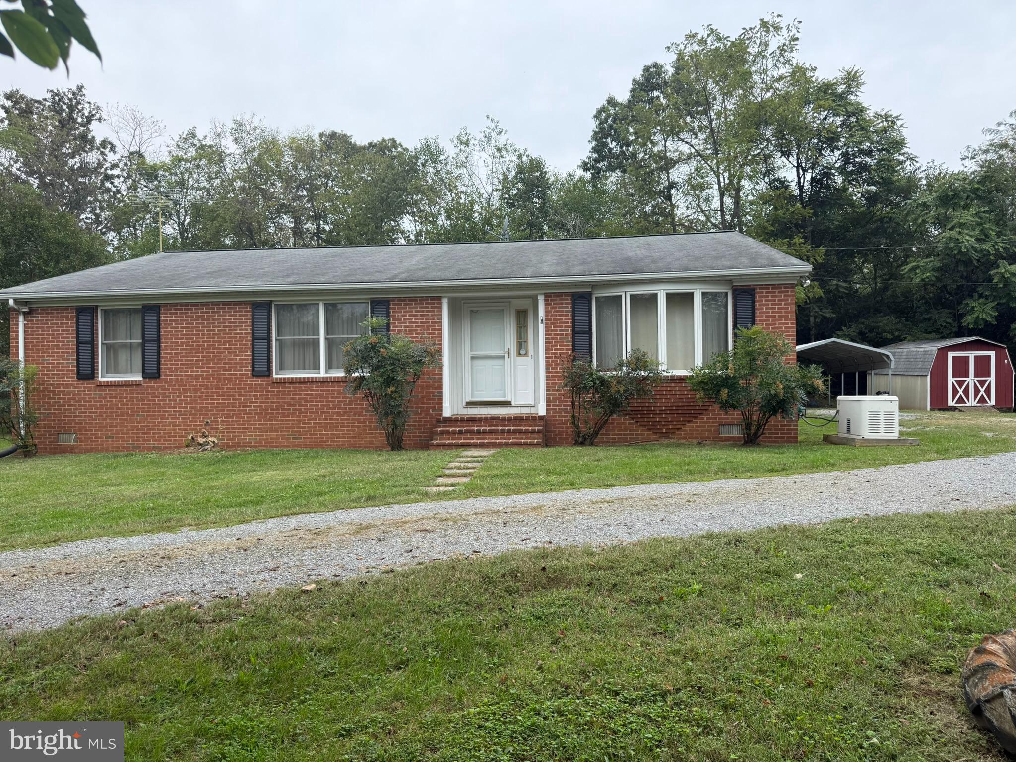 1582 Triple J Road Berryville, VA 22611 - Photo 1 of 2 Front entrance showing generator, carport & shed.
