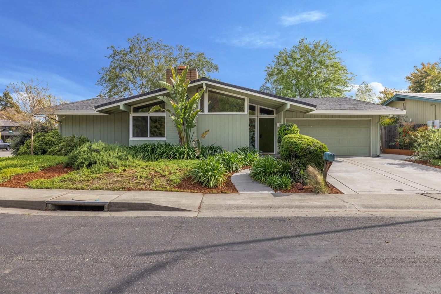 front view of a house with a small yard